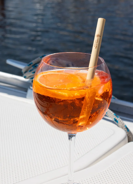 Branded reed straw served in an orange drink